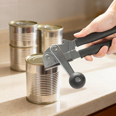 Multi-functional manual can opener stainless steel can and bottle opener in one non-slip labor-saving handle safe and without sharp edges suitable for kitchen tools for cans and bottle caps.