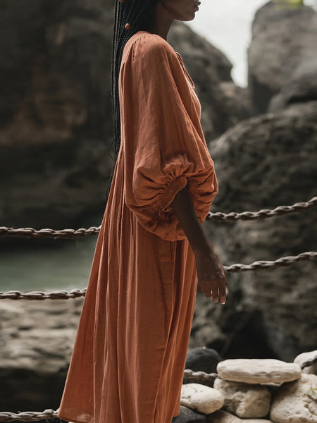 Casual Loose-Fitting Maxi Dress for Women with Lantern Sleeves, a V-Neck, And a Flowy Swing Design. Features 3/4 Puff Sleeves, Perfect for Boho Beach Outings, with a Tie-Up Front And Ruffled Details, Ideal for Vacations