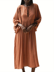 Casual Loose-Fitting Maxi Dress for Women with Lantern Sleeves, a V-Neck, And a Flowy Swing Design. Features 3/4 Puff Sleeves, Perfect for Boho Beach Outings, with a Tie-Up Front And Ruffled Details, Ideal for Vacations