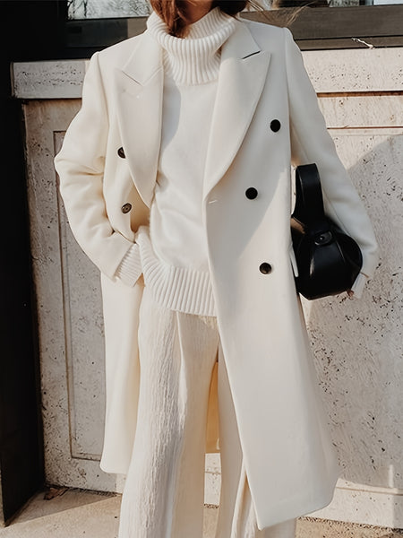 This Elegant Cream White Woolen Coat Features a Double-Breasted Design, Button Details, And a Slim Fit, Making It Perfect for Both Casual And Formal Events During The Fall And Winter Seasons.