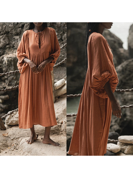 Casual Loose-Fitting Maxi Dress for Women with Lantern Sleeves, a V-Neck, And a Flowy Swing Design. Features 3/4 Puff Sleeves, Perfect for Boho Beach Outings, with a Tie-Up Front And Ruffled Details, Ideal for Vacations