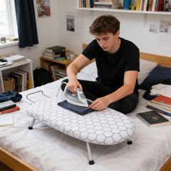 A Compact, Foldable Ironing Board Measuring 66X40Cm, Easy to Store And Lightweight, Making It Ideal for Small Living Spaces Like Apartments And Dorms. It Features Adjustable Height for Convenience
