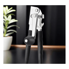 Multi-functional manual can opener stainless steel can and bottle opener in one non-slip labor-saving handle safe and without sharp edges suitable for kitchen tools for cans and bottle caps.