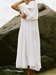 Casual Loose-Fitting Maxi Dress for Women with Lantern Sleeves, a V-Neck, And a Flowy Swing Design. Features 3/4 Puff Sleeves, Perfect for Boho Beach Outings, with a Tie-Up Front And Ruffled Details, Ideal for Vacations
