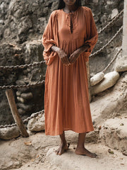 Casual Loose-Fitting Maxi Dress for Women with Lantern Sleeves, a V-Neck, And a Flowy Swing Design. Features 3/4 Puff Sleeves, Perfect for Boho Beach Outings, with a Tie-Up Front And Ruffled Details, Ideal for Vacations