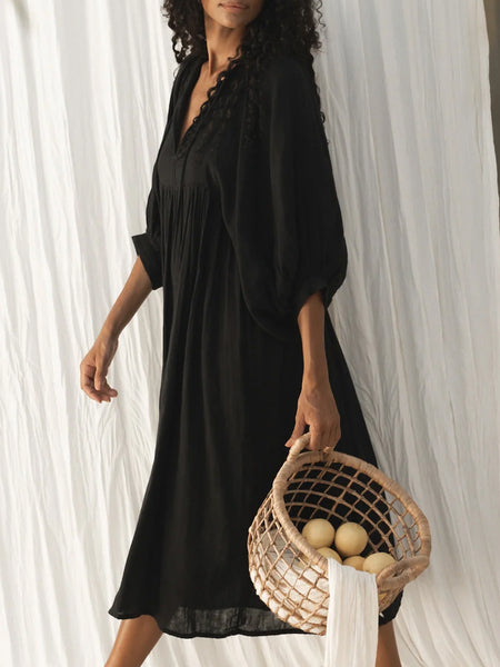 Casual Loose-Fitting Maxi Dress for Women with Lantern Sleeves, a V-Neck, And a Flowy Swing Design. Features 3/4 Puff Sleeves, Perfect for Boho Beach Outings, with a Tie-Up Front And Ruffled Details, Ideal for Vacations