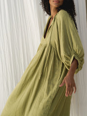 Casual Loose-Fitting Maxi Dress for Women with Lantern Sleeves, a V-Neck, And a Flowy Swing Design. Features 3/4 Puff Sleeves, Perfect for Boho Beach Outings, with a Tie-Up Front And Ruffled Details, Ideal for Vacations