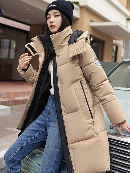 Sophisticated Winter Coat for Women Featuring a Hood And a Full Zipper, Perfect for Chilly Days. This Long-Sleeve Jacket Offers a Tailored Fit And Is Suitable for Both Outdoor And Everyday Travel. Dry Clean Only, Made with High-Quality Materials
