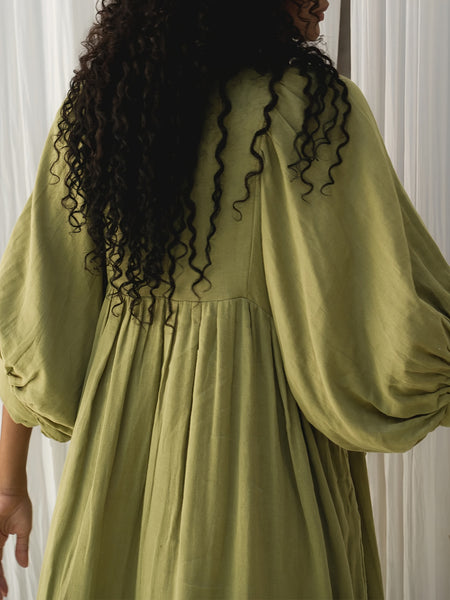 Casual Loose-Fitting Maxi Dress for Women with Lantern Sleeves, a V-Neck, And a Flowy Swing Design. Features 3/4 Puff Sleeves, Perfect for Boho Beach Outings, with a Tie-Up Front And Ruffled Details, Ideal for Vacations