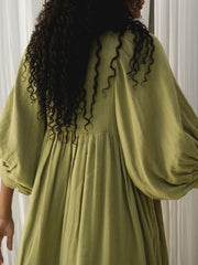 Casual Loose-Fitting Maxi Dress for Women with Lantern Sleeves, a V-Neck, And a Flowy Swing Design. Features 3/4 Puff Sleeves, Perfect for Boho Beach Outings, with a Tie-Up Front And Ruffled Details, Ideal for Vacations