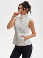 Women's Lightweight Outdoor Puffer Vest, Multi-Pocket Design, Elastic Waist Wrapping for Snug Warmth, Unique Zipper, Stand Collar, Polyester Filled