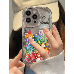 A Soft Protective Phone Case for Iphone 16/15/12/13/14 Featuring a Smiling Face Cartoon Design with an Electroplated Cream Pattern, Ideal for Women. It Is Shock-Proof, Stylish, And Thick.
