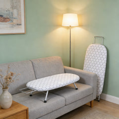 A Compact, Foldable Ironing Board Measuring 66X40Cm, Easy to Store And Lightweight, Making It Ideal for Small Living Spaces Like Apartments And Dorms. It Features Adjustable Height for Convenience