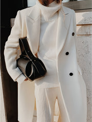 This Elegant Cream White Woolen Coat Features a Double-Breasted Design, Button Details, And a Slim Fit, Making It Perfect for Both Casual And Formal Events During The Fall And Winter Seasons.