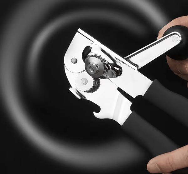Multi-functional manual can opener stainless steel can and bottle opener in one non-slip labor-saving handle safe and without sharp edges suitable for kitchen tools for cans and bottle caps.