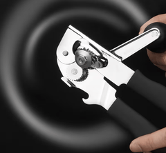 Multi-functional manual can opener stainless steel can and bottle opener in one non-slip labor-saving handle safe and without sharp edges suitable for kitchen tools for cans and bottle caps.