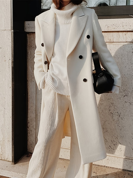 This Elegant Cream White Woolen Coat Features a Double-Breasted Design, Button Details, And a Slim Fit, Making It Perfect for Both Casual And Formal Events During The Fall And Winter Seasons.
