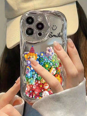 A Soft Protective Phone Case for Iphone 16/15/12/13/14 Featuring a Smiling Face Cartoon Design with an Electroplated Cream Pattern, Ideal for Women. It Is Shock-Proof, Stylish, And Thick.