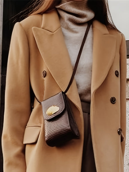 This Elegant Cream White Woolen Coat Features a Double-Breasted Design, Button Details, And a Slim Fit, Making It Perfect for Both Casual And Formal Events During The Fall And Winter Seasons.